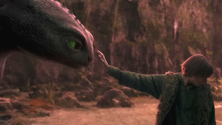Toothless sharing a bonding moment with Hiccup in How to Train Your Dragon