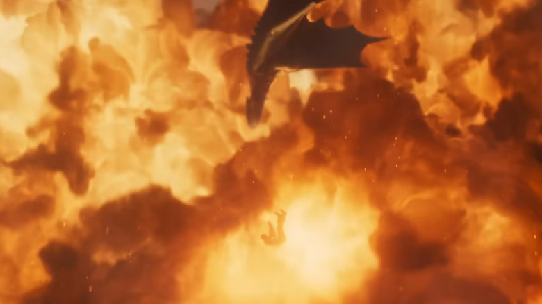 Toothless trying to rescue Hiccup from a wave of fire in How to Train Your Dragon