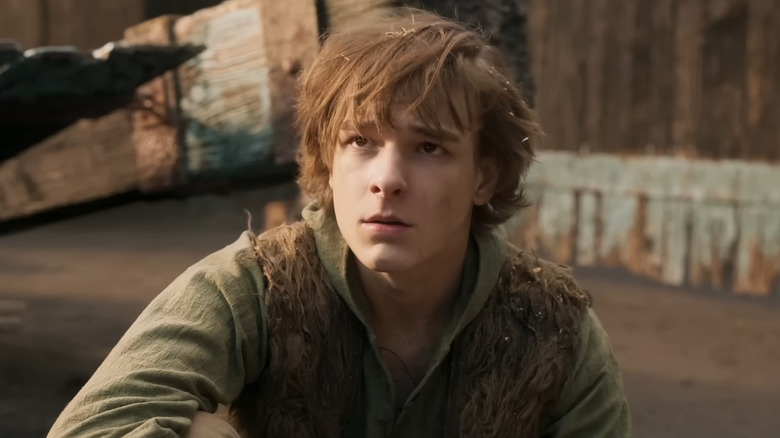Hiccup sitting in the dragon arena in How to Train Your Dragon