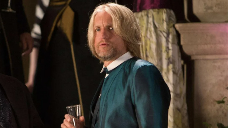 Haymitch is trepidatious at a party in The Hunger Games