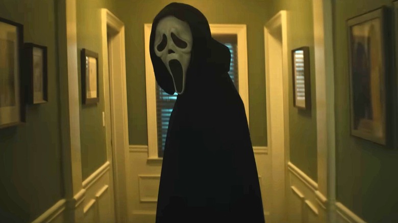 Ghostface standing in the hallway at Sidney's house in Scream 7
