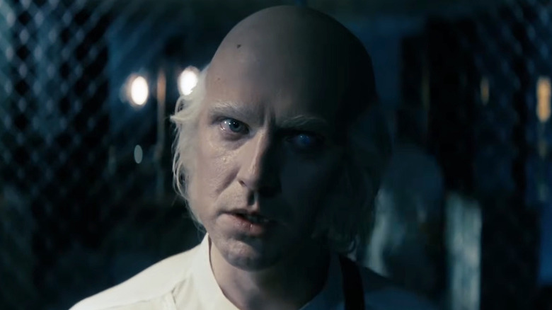 Dan Stevens as Hans Kammler in the lab in Onslaught