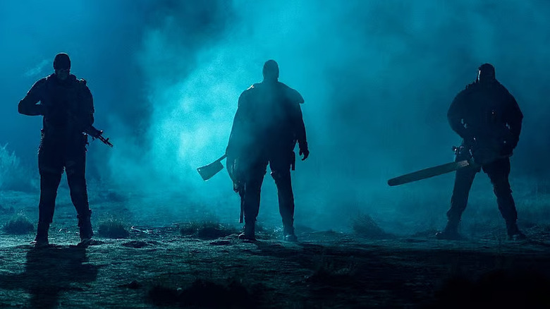 The Crybaby, The Butcher, and the Cockroach standing in the fog in Onslaught