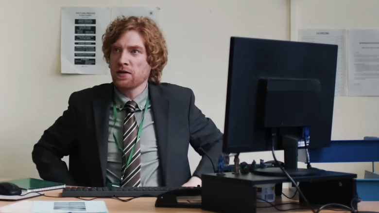 Daniel (Domhnall Gleeson) sits at his computer in The Incomer