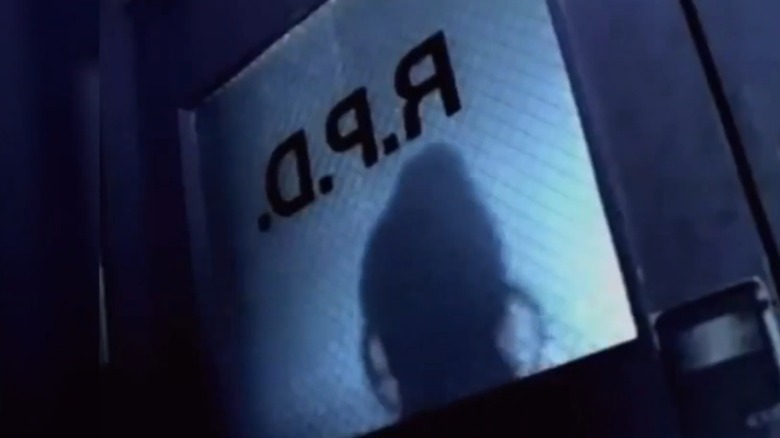 Figure lurking at the door