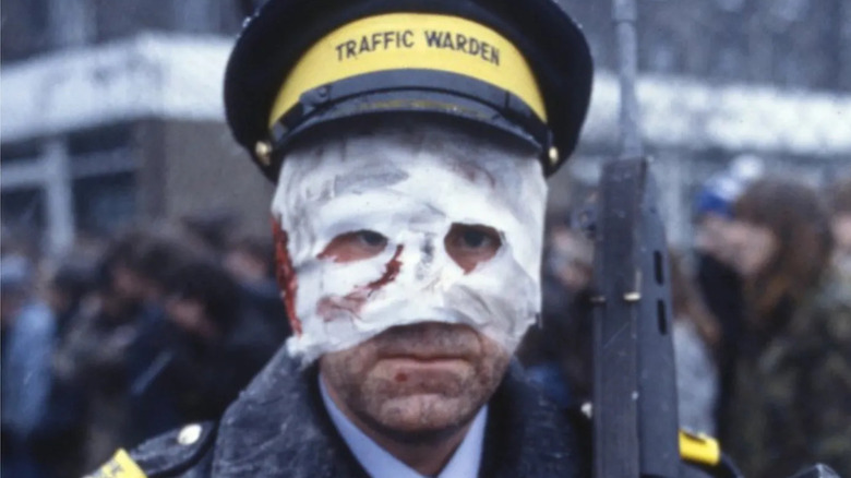 Michael Beecroft's injured traffic warden is seen in closeup in Threads
