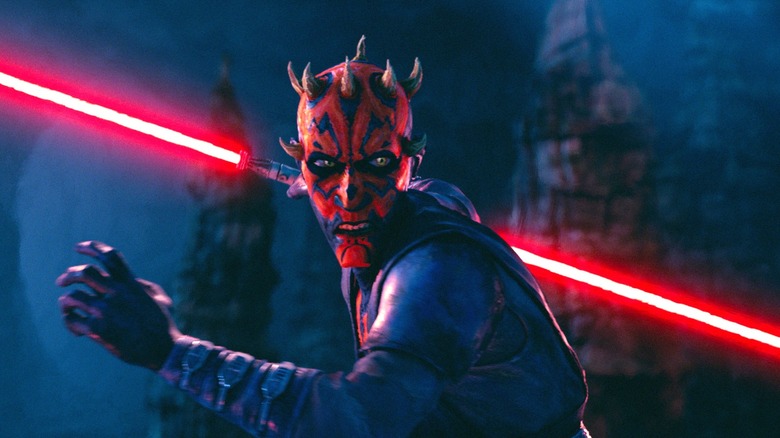 Maul with his lightsaber looking afraid during a fight in Maul - Shadow Lord