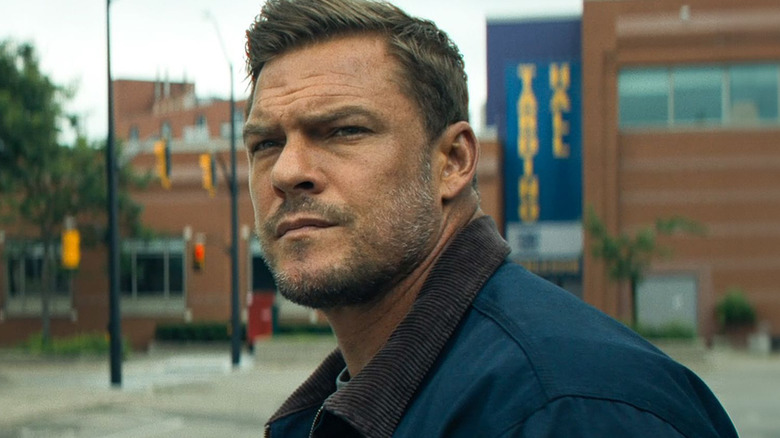 Jack Reacher looking thoughtful in Reacher