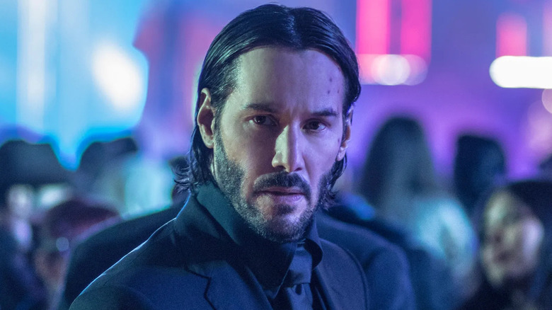 Keanu Reeves as John Wick at a night club in John Wick: Chapter 2