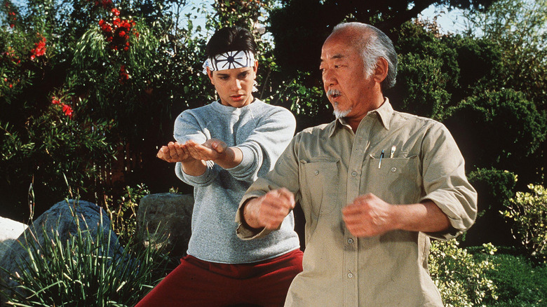 Mr. Miyagi training Daniel LaRusso in The Karate Kid Part II