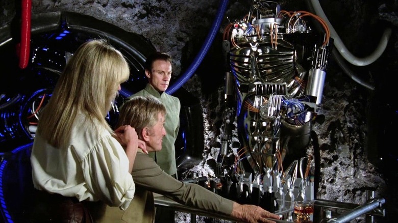 Alex and Adam examine Hector the Robot in Saturn 3