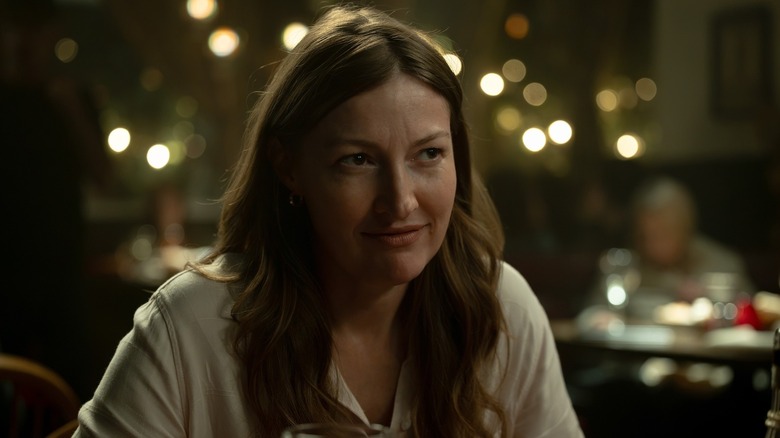 Kelly Macdonald's Kerry Kane sits in a restaurant in Lanterns