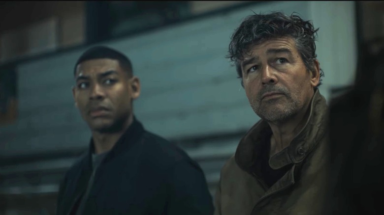 Aaron Pierre as John Stewart and Kyle Chandler as Hal Jordan sitting in the bleachers in Lanterns