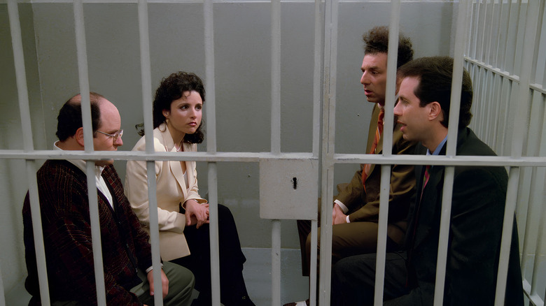 George, Elaine, Kramer, and Jerry, sitting in a prison cell on Seinfeld.