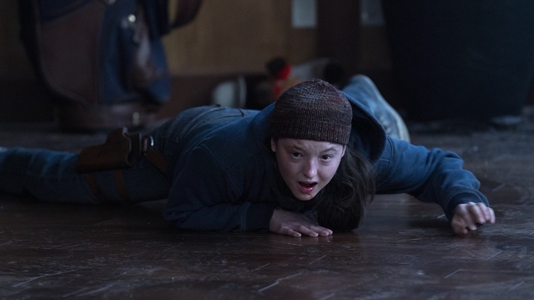 Ellie hysterically crying and screaming while pinned to the floor on The Last of Us