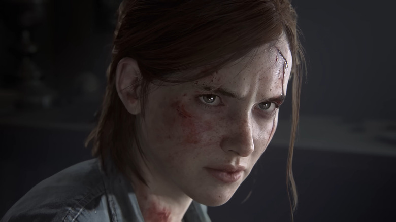 Ellie from The Last of Us Part II looking up with a cut forehead