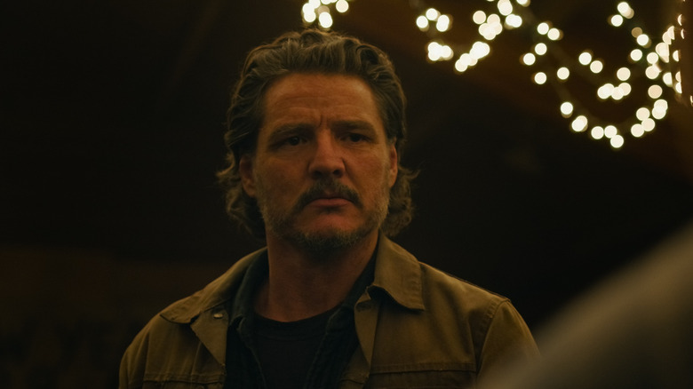 Joel looks nervous from the lights behind him in the last of us 2 season