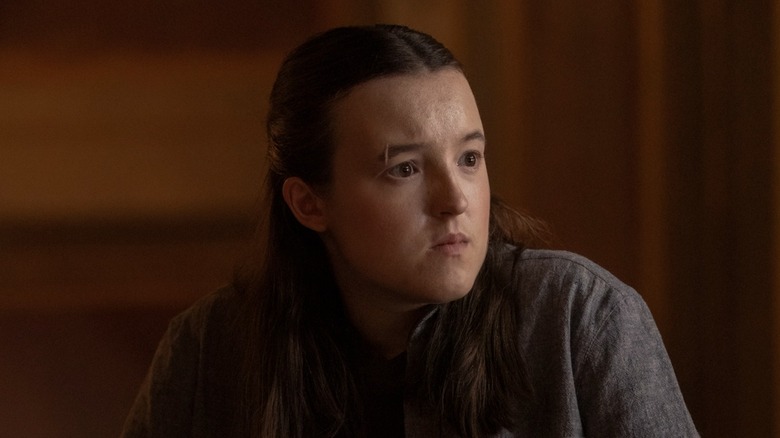 Bella Ramsey's Ellie looking thoughtful on The Last of Us