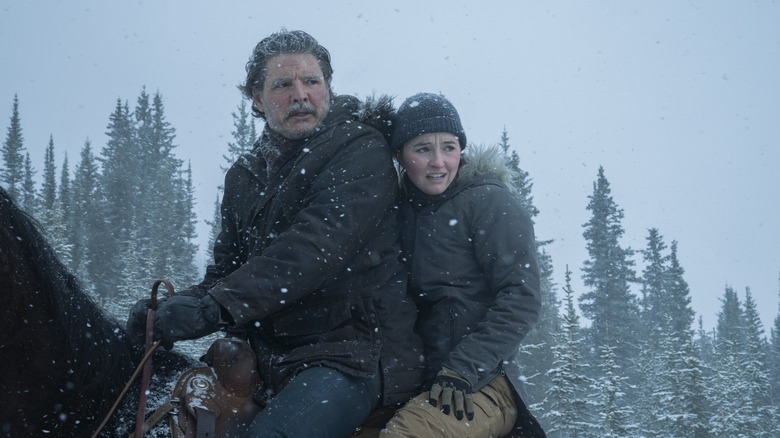 Abby gets on a horse in the snow with Joel in the last season 2