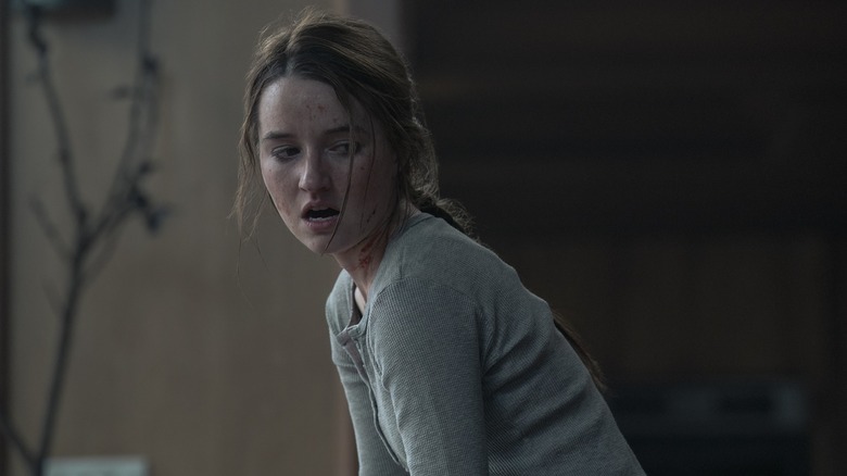 Abby with blood on her face gasping and looking to the side on The Last of Us