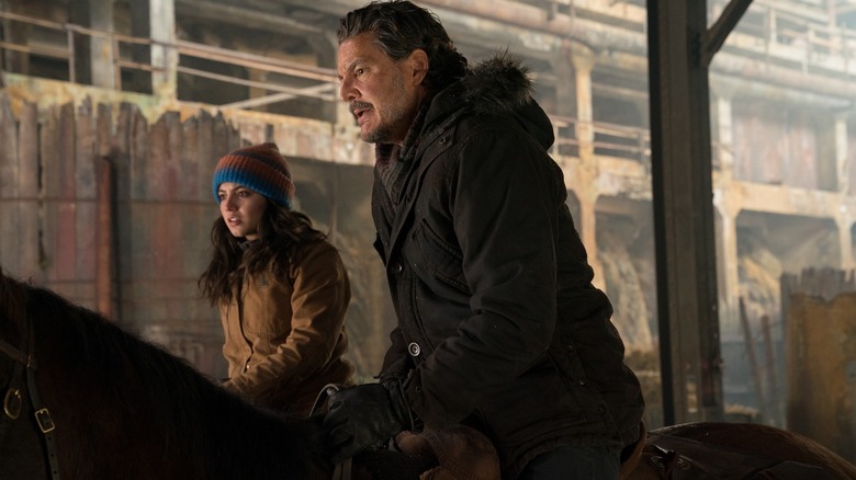Pedro Pascal as Joel and Isabela Merced as Dina on horseback in The Last of Us