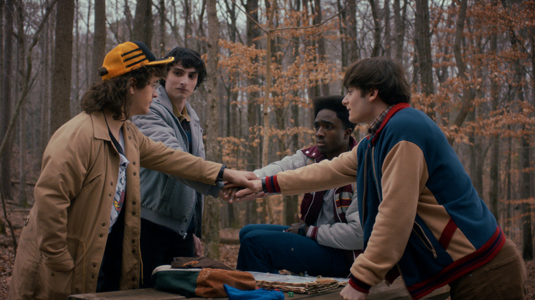 Dustin, Mike, Lucas and Will make a pact in the woods in Stranger Things