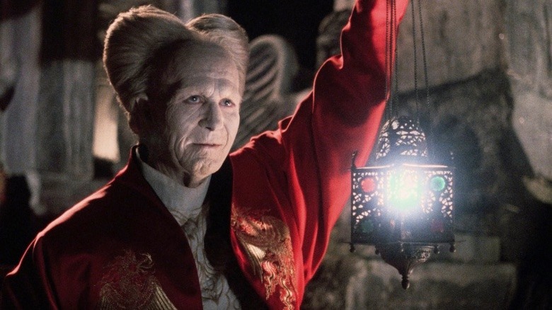 Dracula holding lantern
