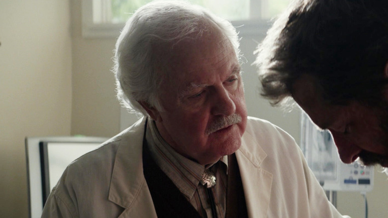 James Handy as an old doctor urging Hugh Jackman as Wolverine to get medical help in Logan