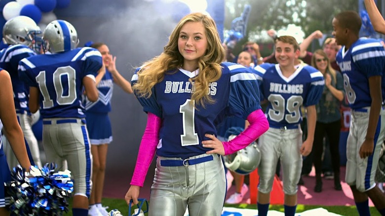 Brec Bassinger dons a football uniform as Bella Dawson in Bella and the Bulldogs