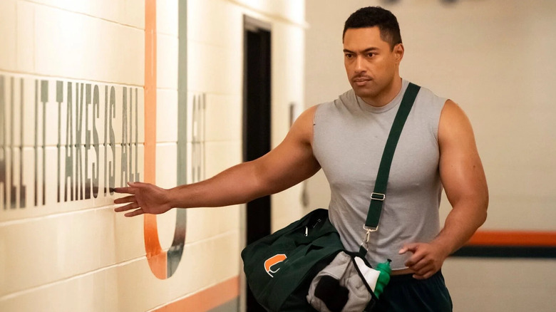A young Dwayne Johnson walking down a hallway in Young Rock