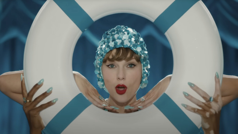 Taylor Swift seen through a buoy in the music video for The Fate of Ophelia