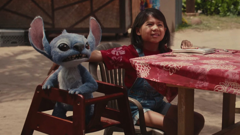Stitch and Lilo sitting at a table in Lilo & Stitch