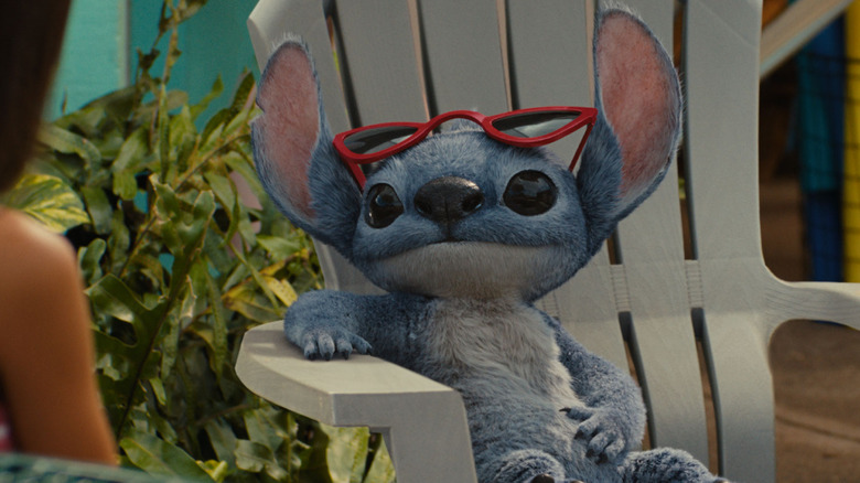 Stitch sitting in a beach chair in Lilo & Stitch
