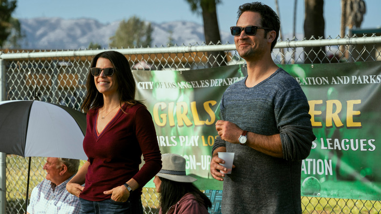 Neve Campbell and Manuel Garcia-Rulfo in The Lincoln Lawyer
