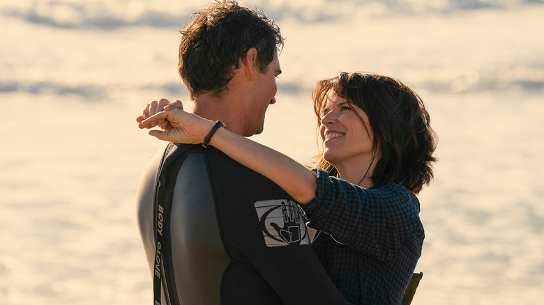Mickey Haller and Maggie McPherson look lovingly into each other's eyes on the beach in "The Lincoln Lawyer"
