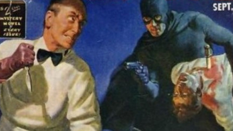 Black Bat memegang penjahat yang ditikam sambil mengarahkan pistol ke orang lain di sampul Detektif Buku Hitam