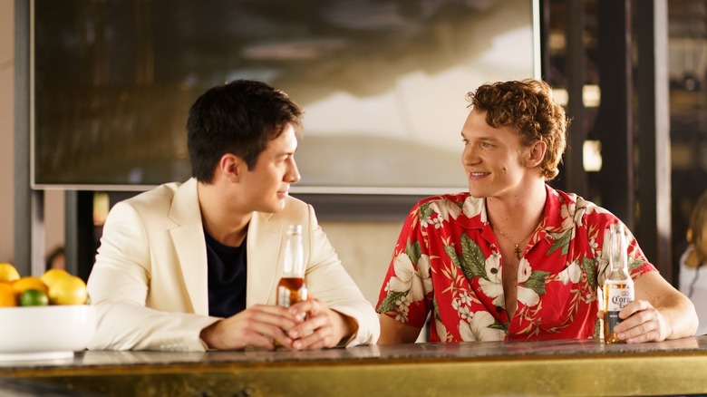 Shane and Ilya drinking beers at a bar on Heated Rivalry