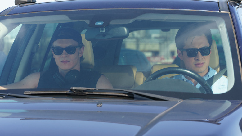 Ilya and Shane in the car driving to the cottage in Heated Rivalry