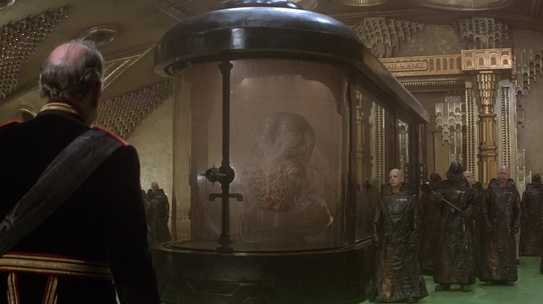 A mutated member of the spacing guild talking to Shaddam IV in Dune