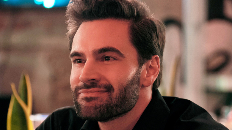 Adam smiling in The Love Hypothesis