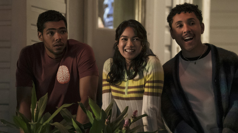 Jeremy, Anh, and Malcolm watching Olive and Adam kiss in The Love Hypothesis