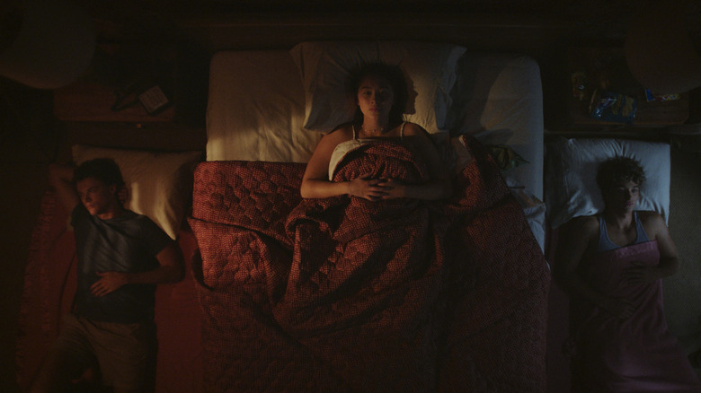 Conrad and Jeremiah sleeping on the floor with Belly in bed between them on The Summer I Turned Pretty