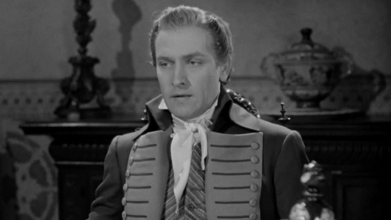 Anthony Adverse, looking stern in formal wear
