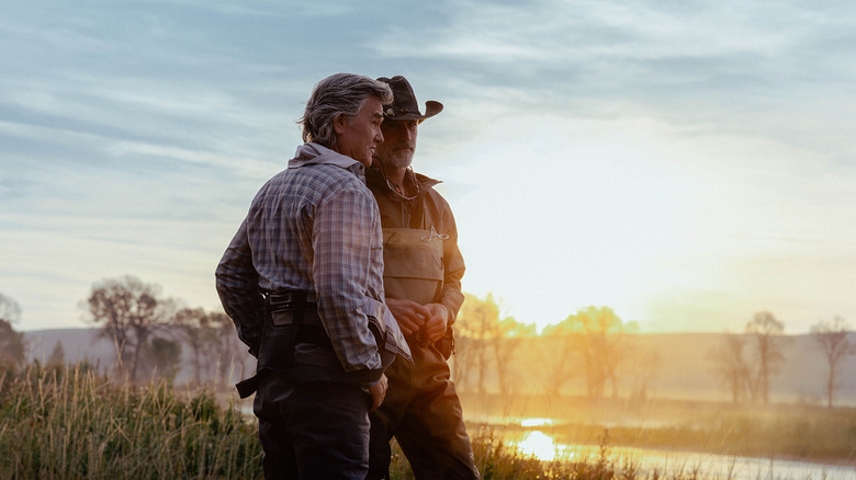 Kurt Russell's Preston Clyburn stands next to Matthew Fox's Paul Clyburn in the Madison River Valley in The Madison