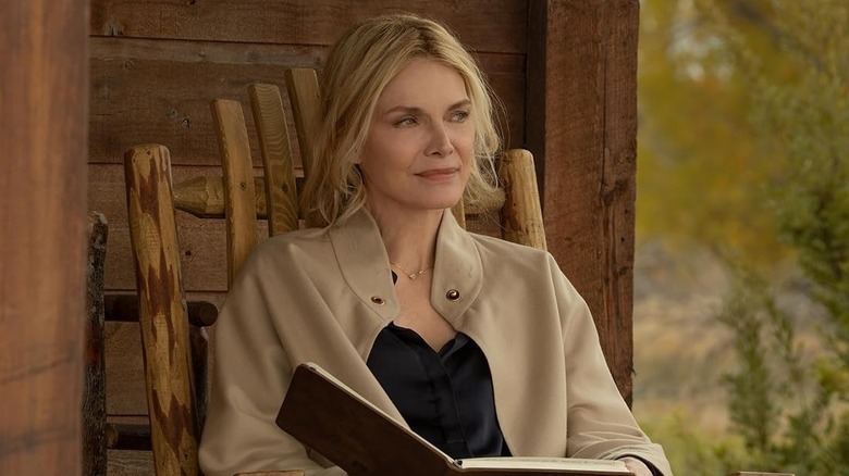 Stacy (Michelle Pfeiffer) sitting on a porch on The Madison