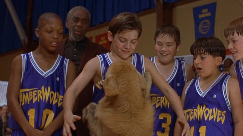 Buddy the dog jumps up at Kevin Zegers' Josh Framm as he's surrounded by his basketball team in Air Bud
