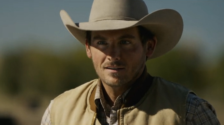 Kevin Zegers' Cade Harris is seen in closeup as he stands outside in The Madison