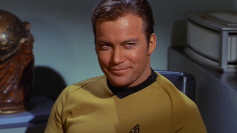 James T. Kirk (William Shatner) smiles slyly in Star Trek: The Original Series