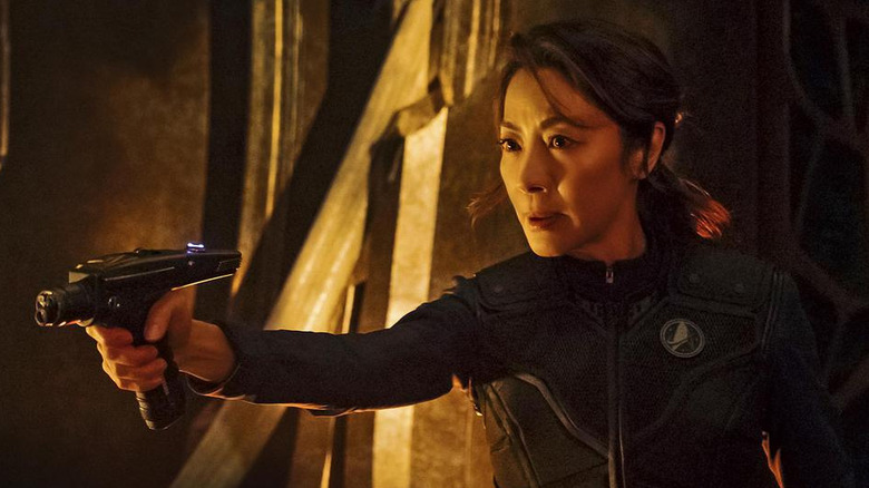 Philippa Georgiou (Michelle Yeoh) points a phaser in Star Trek: Discovery