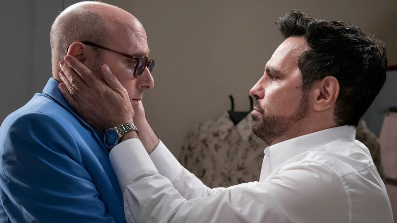 Mario Cantone touching Willie Garson's face 
